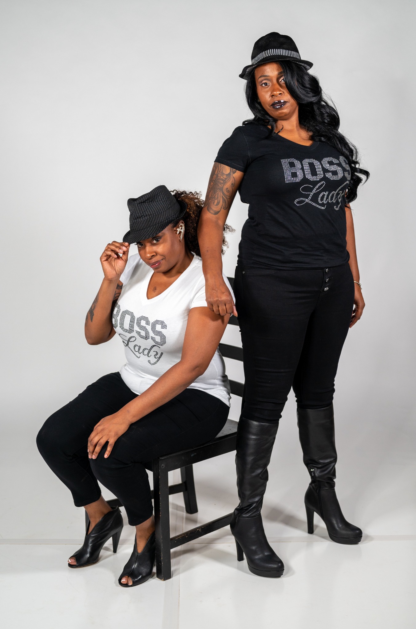 Tracey and Stacey L posing together in coordinated Boss Lady outfits